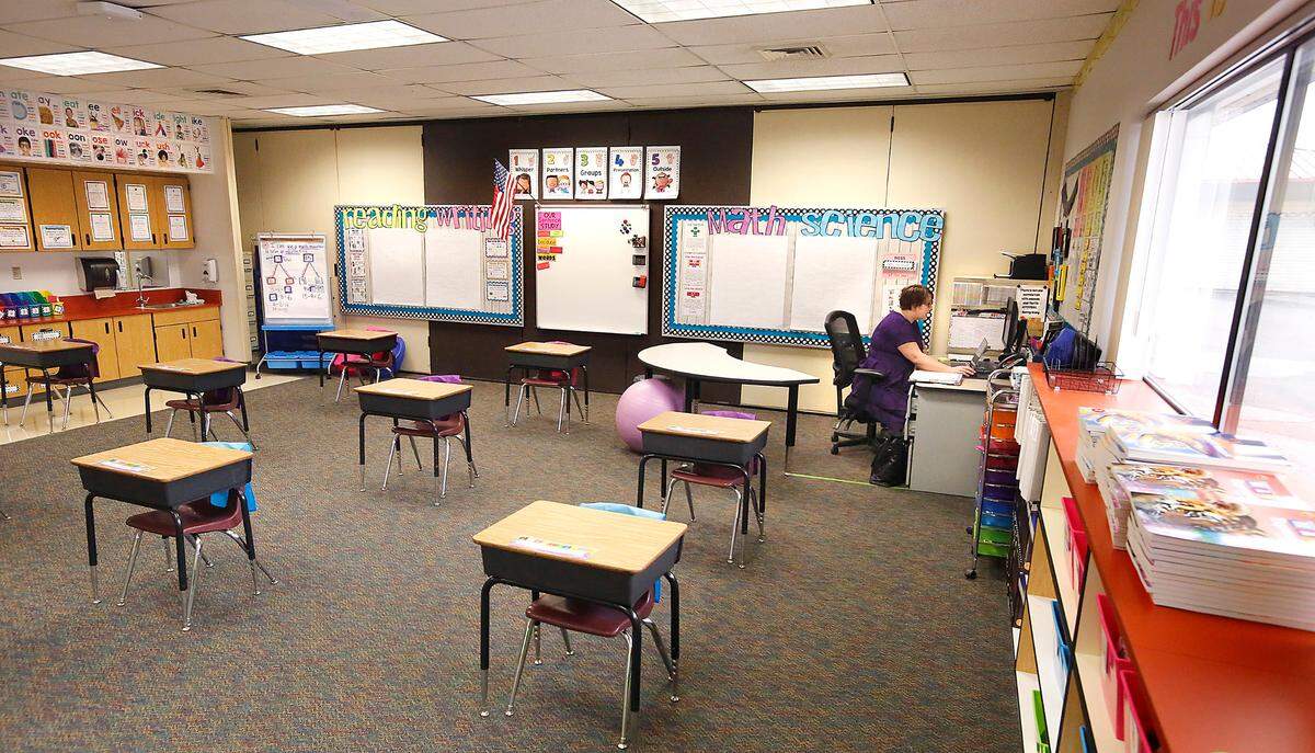 Second-grade teacher Rachael Duncan conducts an online video class session with her students from her empty classroom at Captain Gray STEM Elementary School in Pasco.