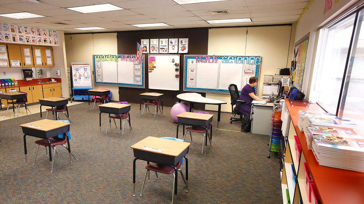 Second grade teacher Rachael Duncan conducts an online video class session with her students from her empty classroom at Captain Gray STEM Elementary School in Pasco.