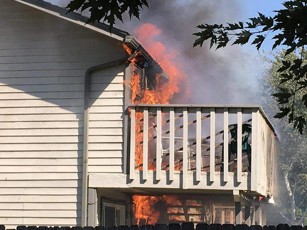 Fire officials say a passerby reported this blaze on Hood Avenue in Kennewick on Wednesday that may have started on a wooden deck. No one was home and several pets had to be rescued. Watch a video at: tricityherald.com/video