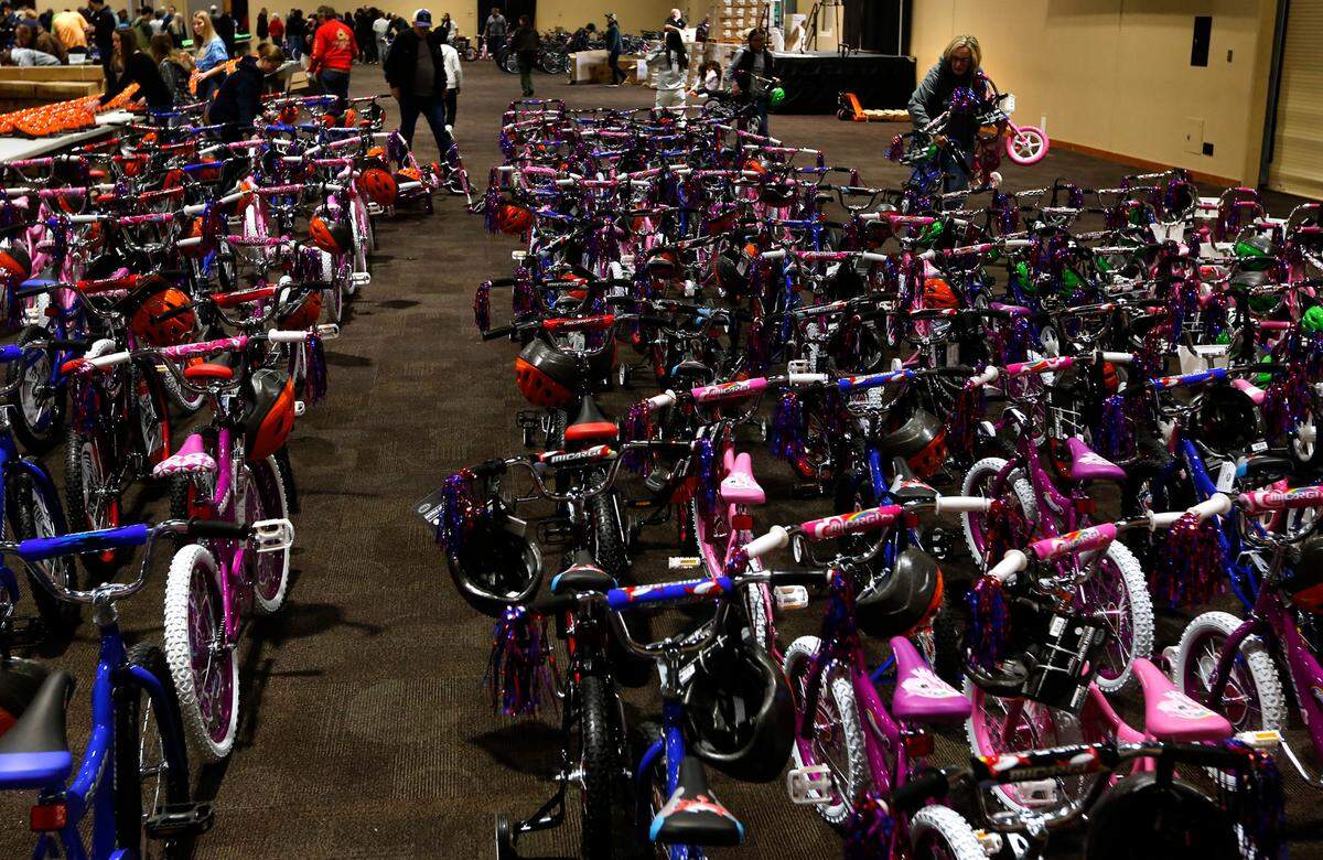 Community volunteers line up completed bikes at the 13th annual Bikes for Tikes bike build event at the Three Rivers Convention Center in Kennewick. More the 600 volunteers assembled 1,600 bicycles in about four hours to be distributed to children in need throughout the Mid-Columbia. The organization was founded in 2009 by the Plumbers & Steamfitters UA Local 598 and through this year have donated more than 18,500 bicycles. A safety helmet is also included with each bike..