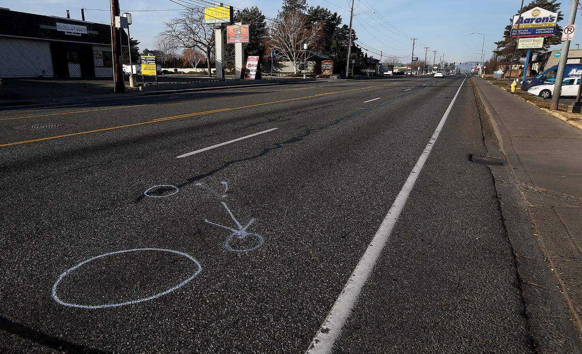Police investigative paint markings indicate where a 28-year-old woman was hit Feb. 6 on Clearwater Avenue in Kennewick.