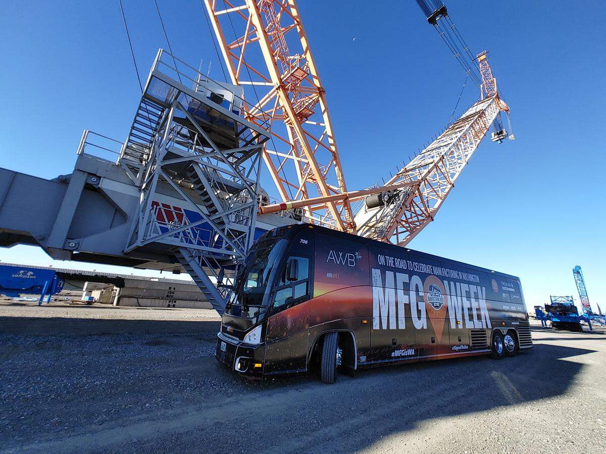 The Association of Washington Business visited Lampson International’s crane facility at Big Pasco Industrial Park during its 2023 manufacturing tour of Washington. The tour bus parked in front of the Transi-Lift 3000 that dominates the Pasco skyline.