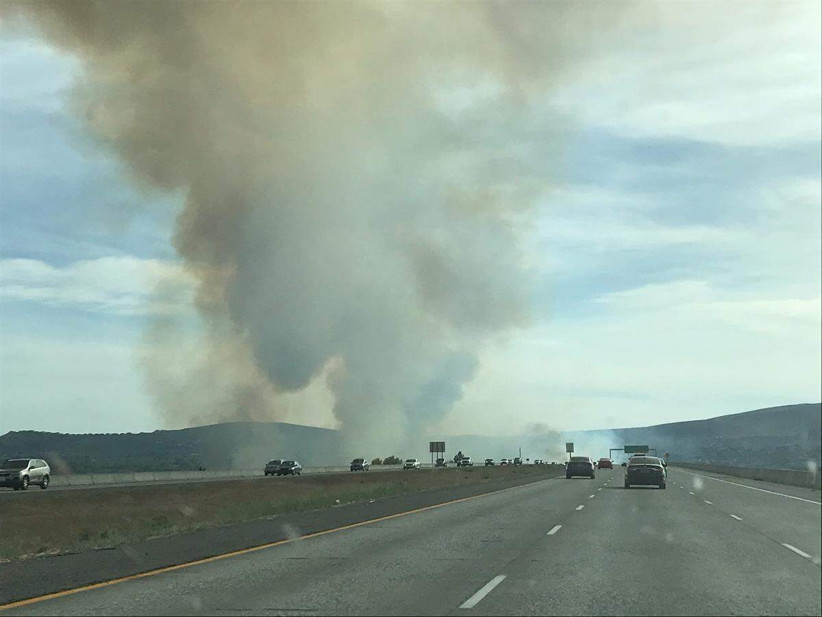 Plumes of smoke spread as embers from the Yakima Delta Fire reignited on Thursday.