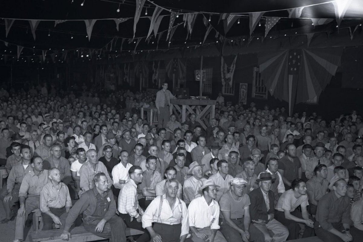 Outdoor assembly and a movie at the Hanford construction camp during a World War II war bond drive.
