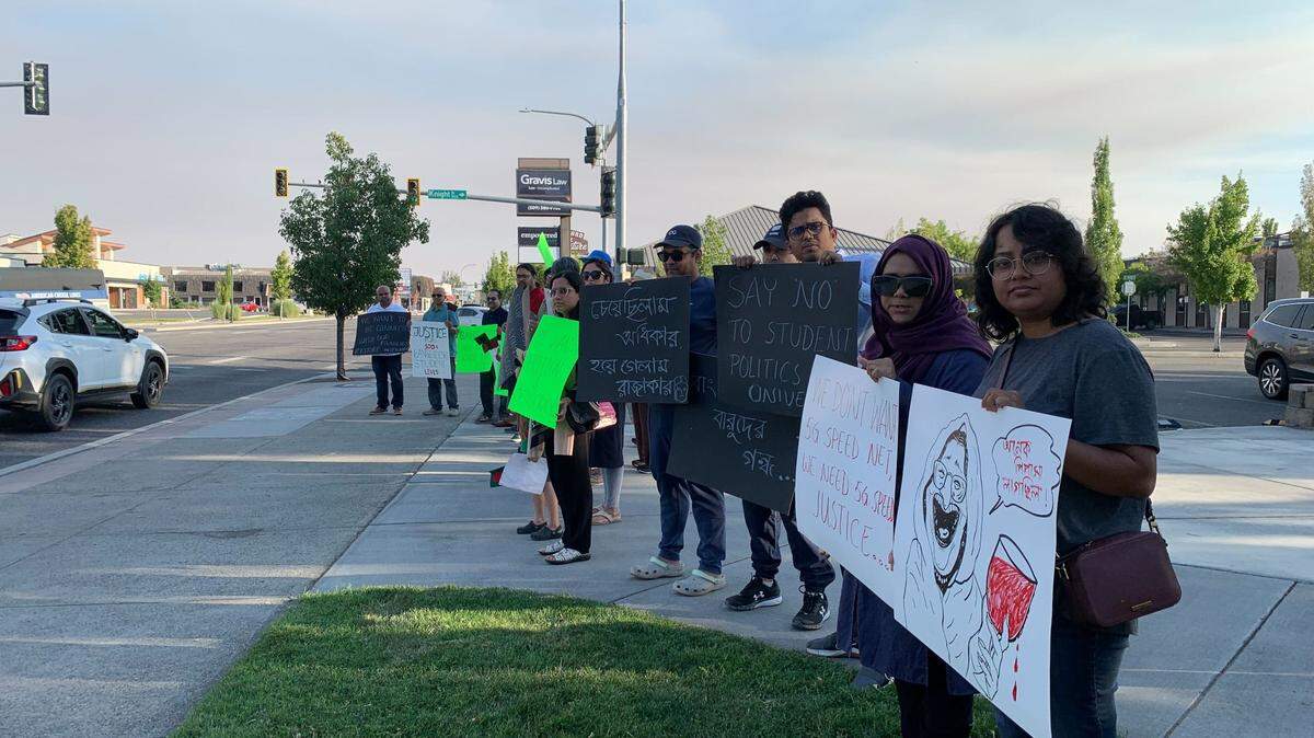 The Bangladeshi community of Tri-Cities gathered near John Dam Plaza on Tuesday, July 23 to spread awareness among drivers on George Washington Way regarding the killings of more than 150 Bangladeshi students.