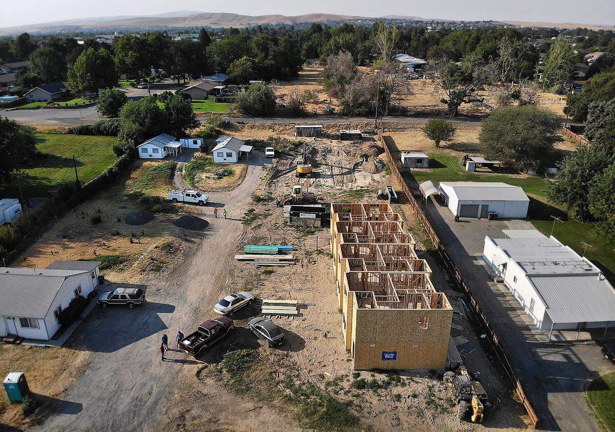 Retired teacher Steve Buckingham and his business partners are working on a $2 million townhome project in an area of Kennewick that once had prefabricated homes built for Hanford workers in the 1940s.