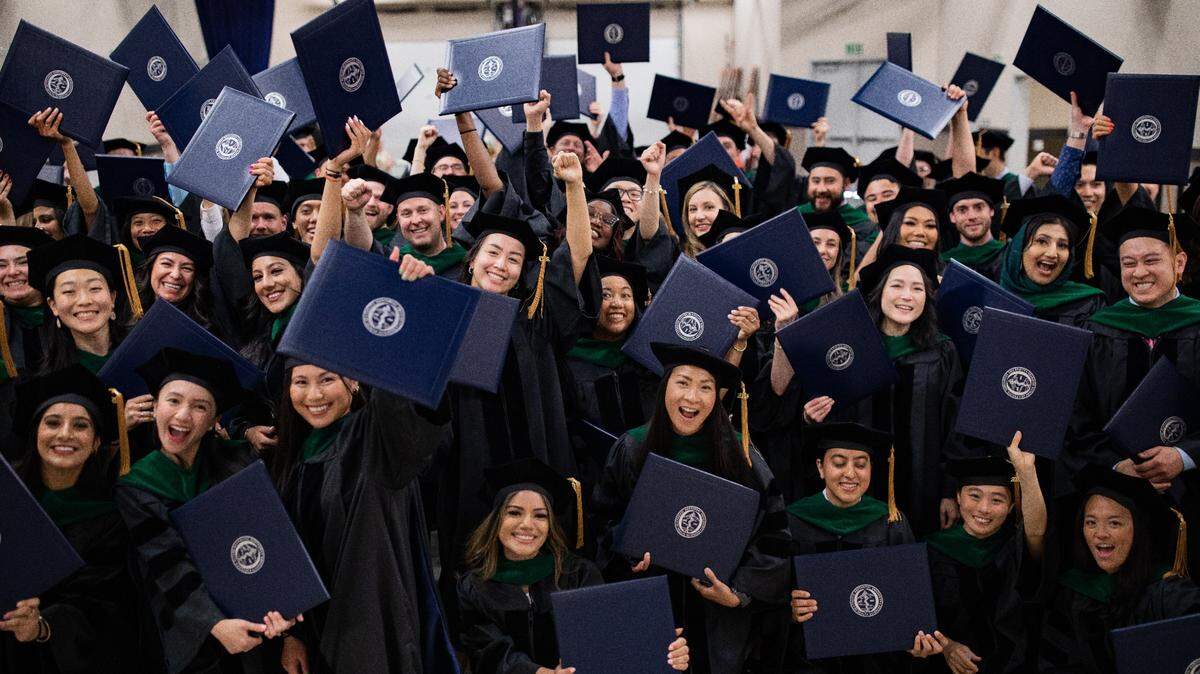 A group of newly graduated Doctors of Osteopathic Medicine (DOs) celebrate together during PNWU’s 12th annual Commencement Ceremony in Yakima, WA.