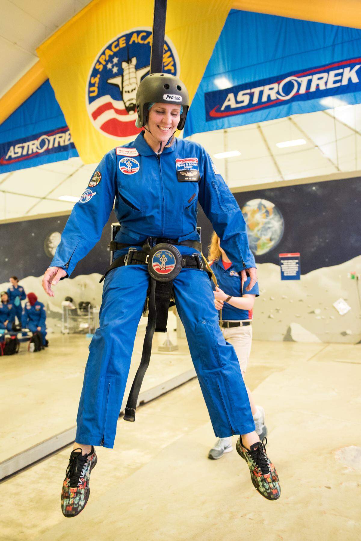 Pasco teacher Kim Van Eaton tries out a gravity chair at Honeywell Educators at Space Academy at the U.S. Space and Rocket Center  in Huntsville, Ala. on June 24, 2018.