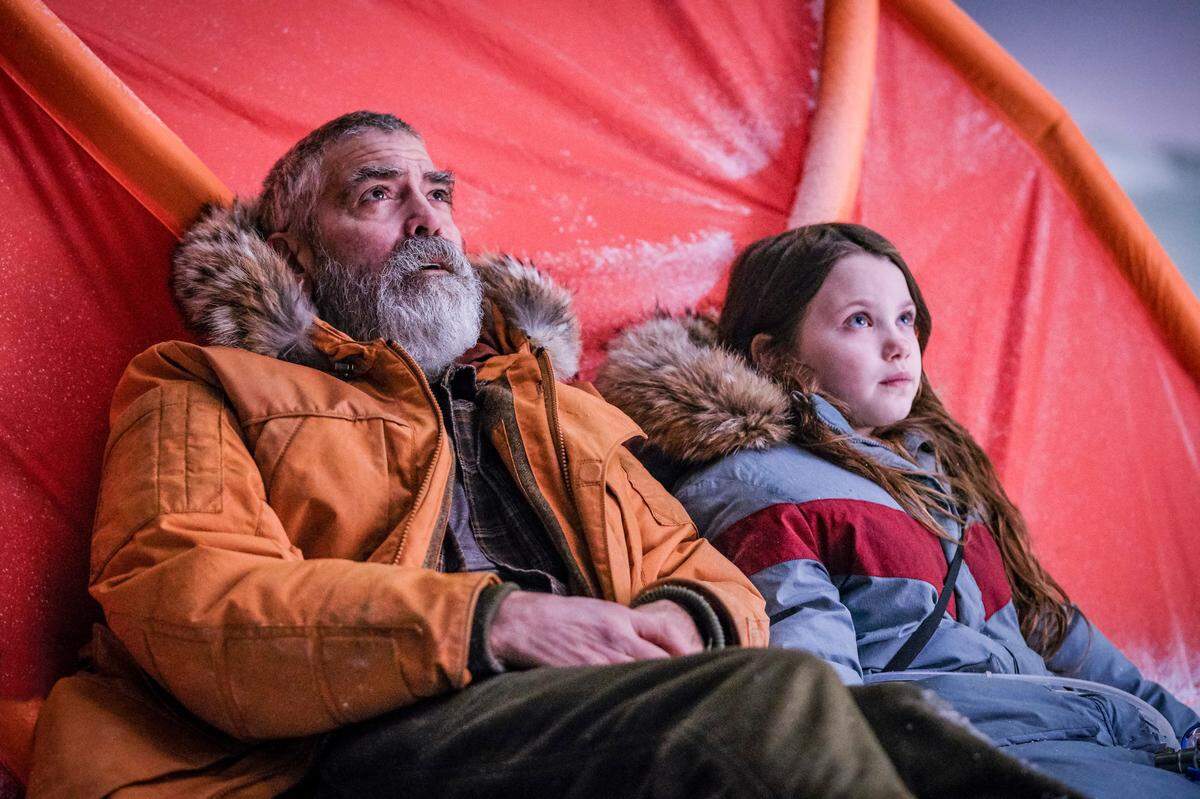 George Clooney and Caoilinn Springall in “The Midnight Sky.”