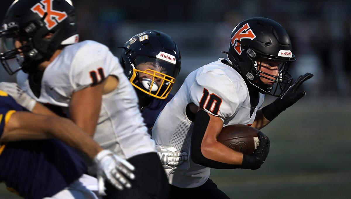 Kennewick running back Canaan Hays fights off a Southridge defender during a run Sept. 13, 2024 at Lampson Stadium in Kennewick.