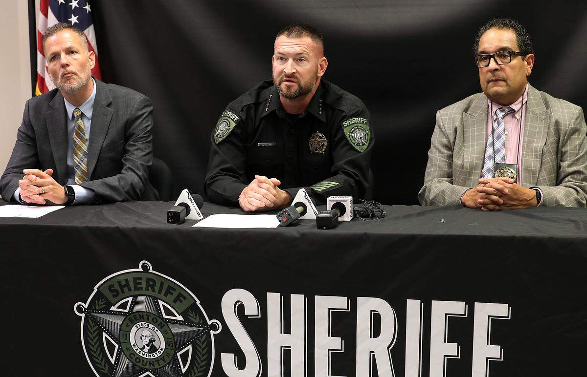 Benton County Prosecutor Eric Eisinger, interim Benton County Sheriff Mike Clark and Benton County Detective Sergeant Horacio Gonzalez, from left, hold a press conference Tuesday about the domestic violence murder suicide that happened Nov. 15 near Prosser.