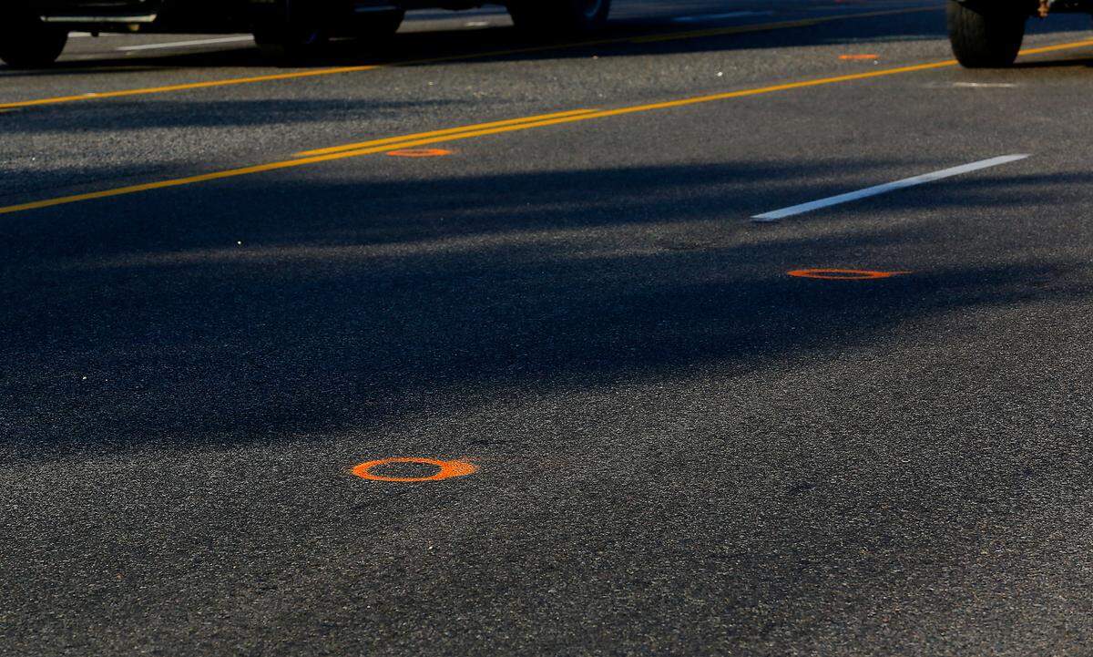 Traffic drives past multiple police investigation evidence paint circles on Highway 397 where Jatzivy Sarabia, 18, was apparently killed on Oct. 15, 2022 when shots were fired into the car she was riding in, according to the Benton County Sheriff’s Office. Law enforcement officials believe that the deadly confrontation between two cars started about 11:40 p.m., when gunfire was reported on or near Highway 397, also called Chemical Drive.