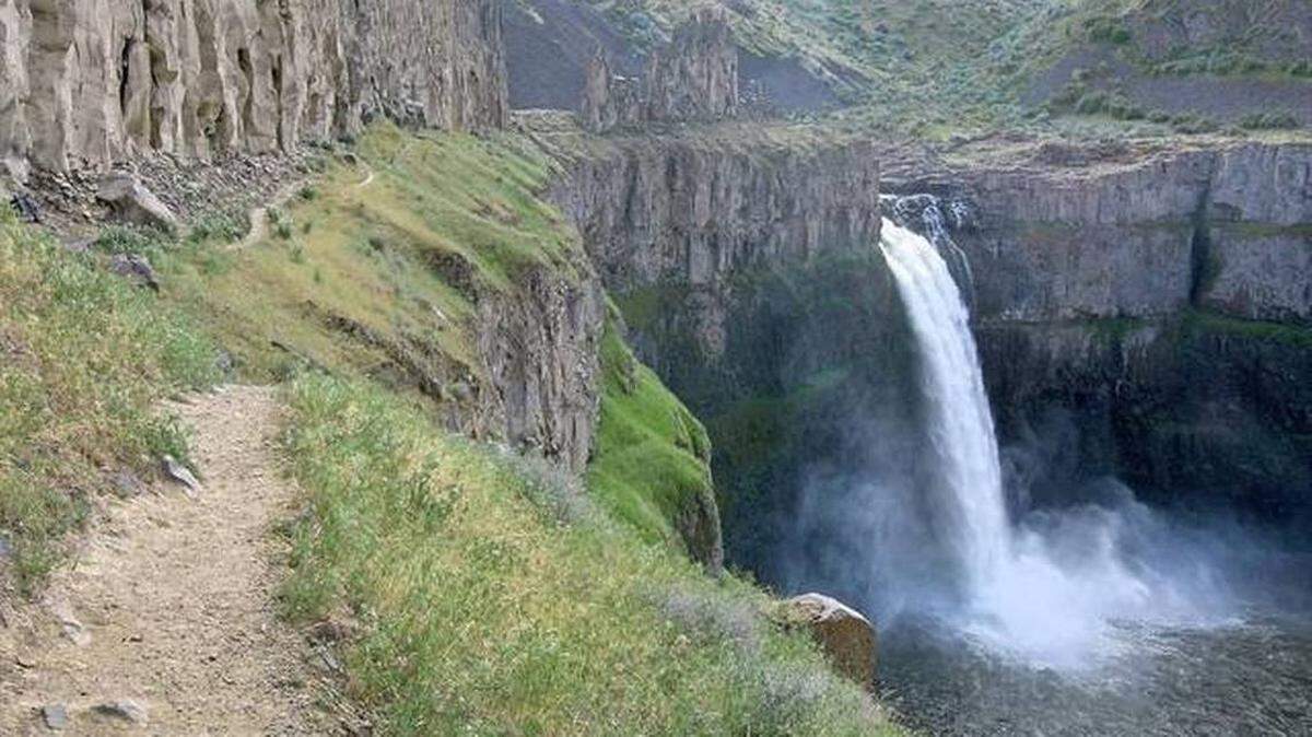 Hikers often venture out on the unofficial trails at Palouse Falls State Park despite state warning signs.