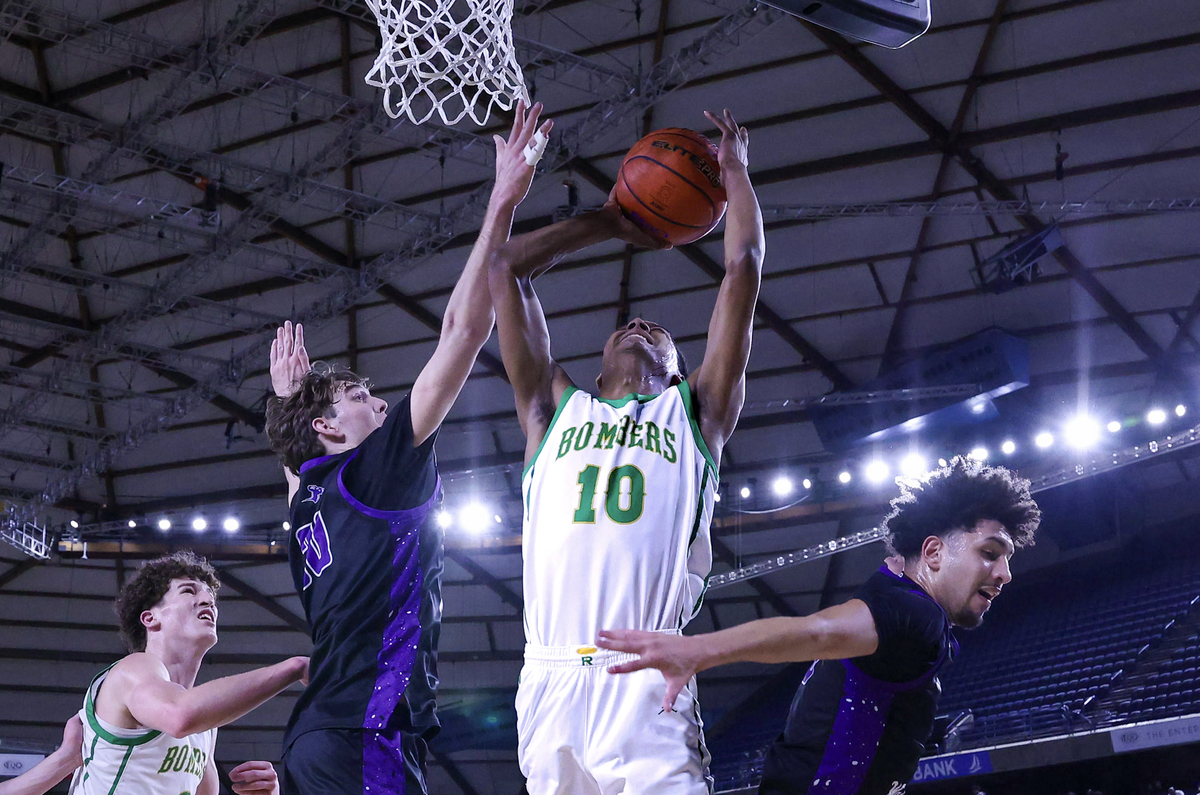 Richland senior Josiah Scacco (10) goes up for a shot against Lake Washington during the WIAA Class 4A boys state basketball semifinals Friday, March 6, 2026, at the Tacoma Dome in Tacoma. Scacco led the Bombers with seven rebounds, including three offensive boards, as Richland defeated Lake Washington 83-70 to advance to the championship game.