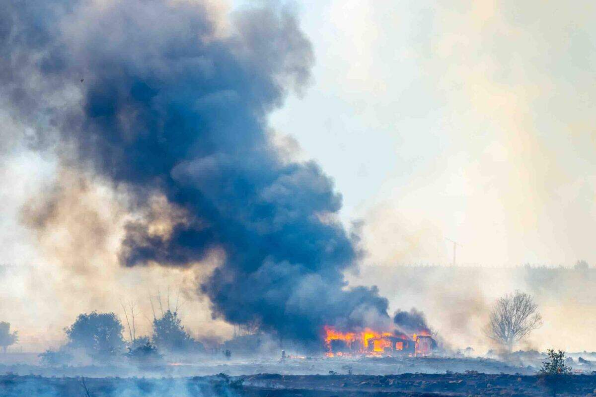 A fire east of Benton City was forcing some residents to be evacuated as it burned near the Old Inland Empire Highway just north of Interstate 82 on Sunday.