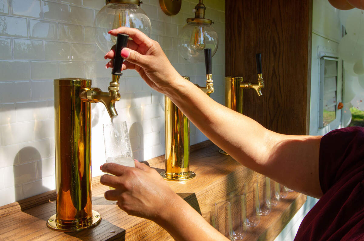 Criselda Davila pours a drink from one of her La Cantina Mobile Bar trailers. As her mobile bar service has grown in popularity, so have her plans for expansion.