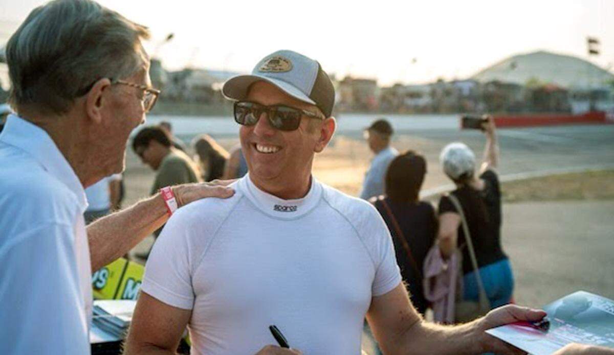 Former Tri-City Raceway owner Wayne Walden talks to Greg Biffle after a race. Biffle got his start on tracks like Walden’s in the 1990s.