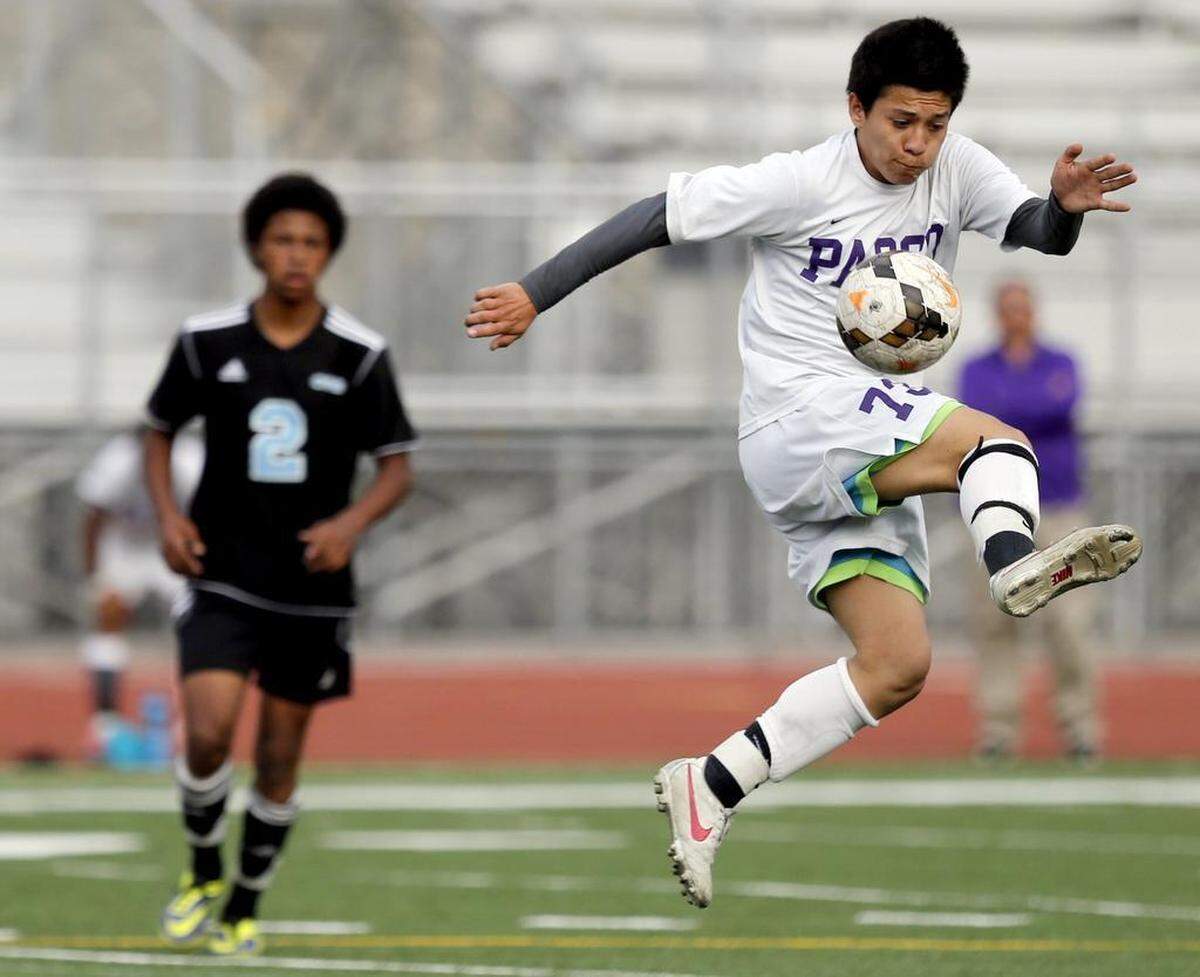 Pasco's Emilio Meraz Rodriguez (7) kicks a ball upfield past Central Valley's Noah Whitman during a game at Edgar Brown Memorial Stadium.