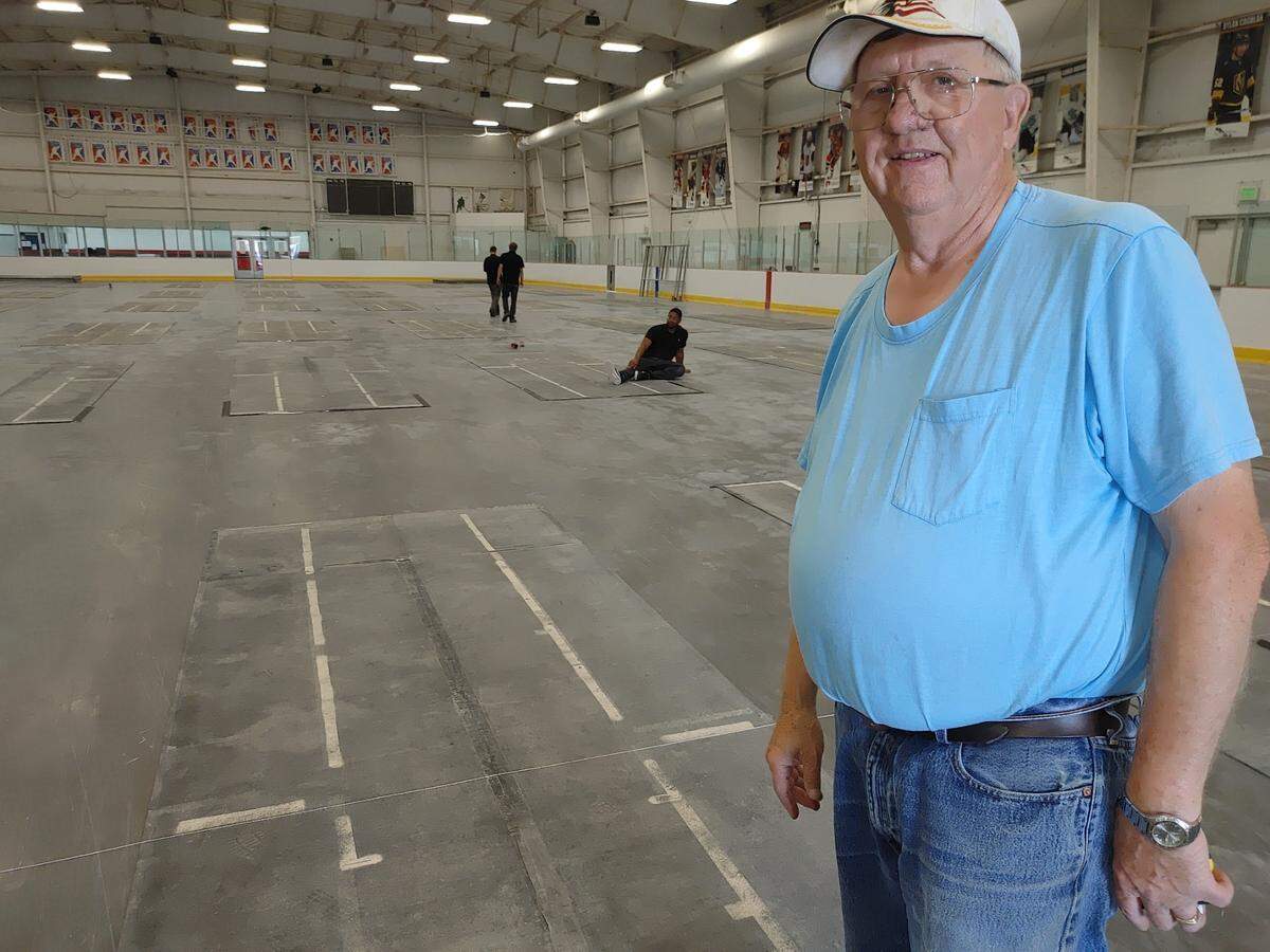 Vic Magnus, a retired Department of Energy worker, helps set up the Toyota Center Arena for the National Horseshoe Pitchers Association’s World Tournament, which begins July 29.