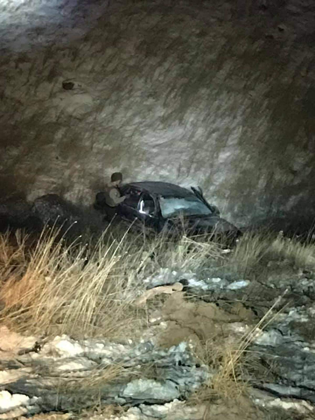 Benton County sheriff’s deputies were called to check on this car that had slid off slippery Badger Canyon Road and rolled into a ravine. They said the people inside were extremely lucky and suffered just minor injuries.