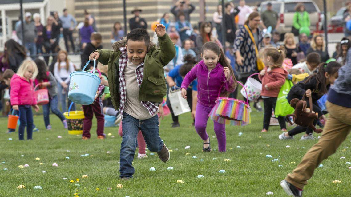 Kids run onto a field to collect Easter eggs at the Gesa Carousel of Dreams in Kennewick in this 2019 file photo.