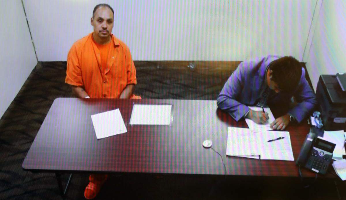 Murder suspect Jesse Lee Castillo, 51, sits with his provisional public defense attorney Michael A. Nguyen during a hearing Tuesday afternoon in Franklin County Superior Court. 