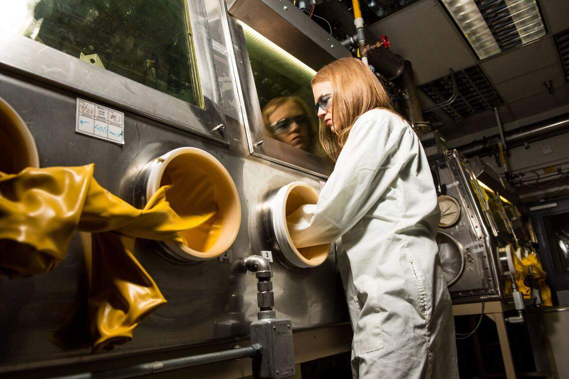PNNL chemical engineer Amanda Casella works in a protective glove box in the Radiochemical Processing Laboratory, a unique facility with capabilities that can be applied to study the properties of tomorrow’s advanced reactor fuels and components.