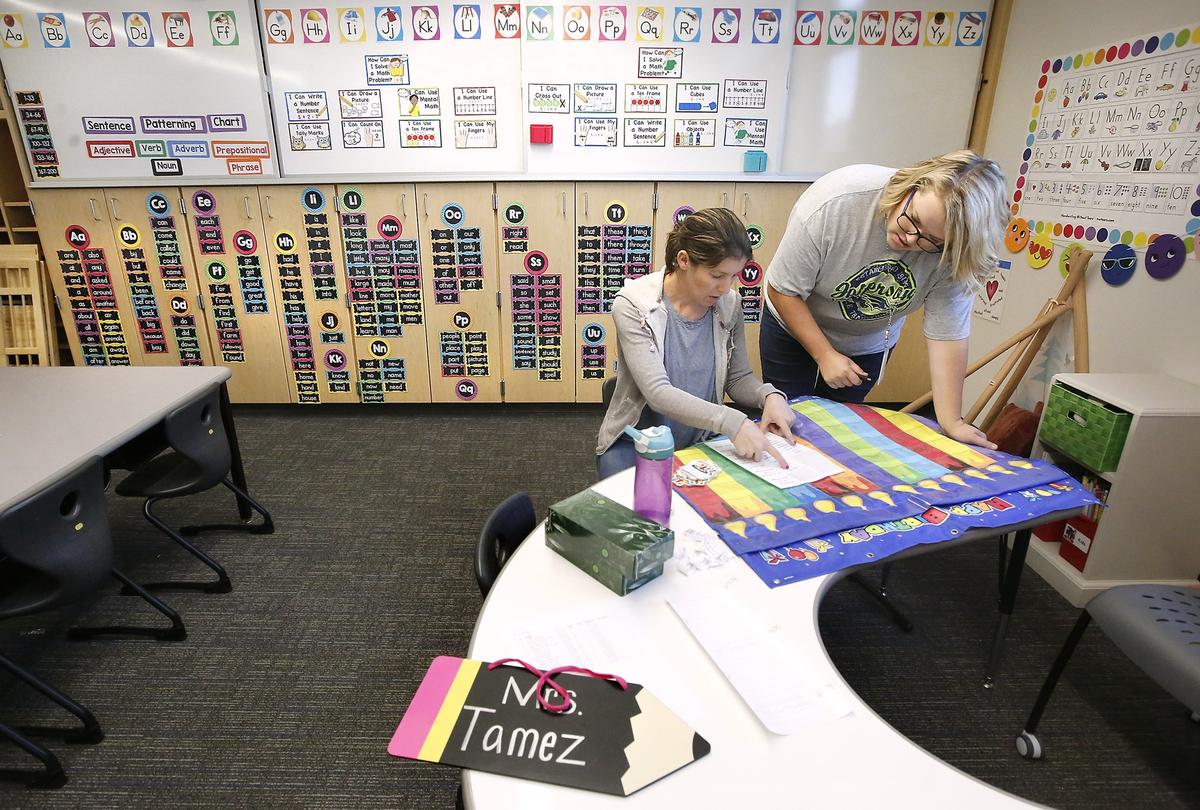 Parent volunteer Molly Stegen, left, and first-grade teacher Andrea Tamez work together Monday preparing the new classroom for students at Jefferson Elementary School in Richland. The new $20.5 million building is 65,000 square feet and is on the same site as the old Jefferson which opened in the ‘50s. The first day of school for most Richland students is Aug. 28. Watch a video on the new school at: tricityherald.com/video