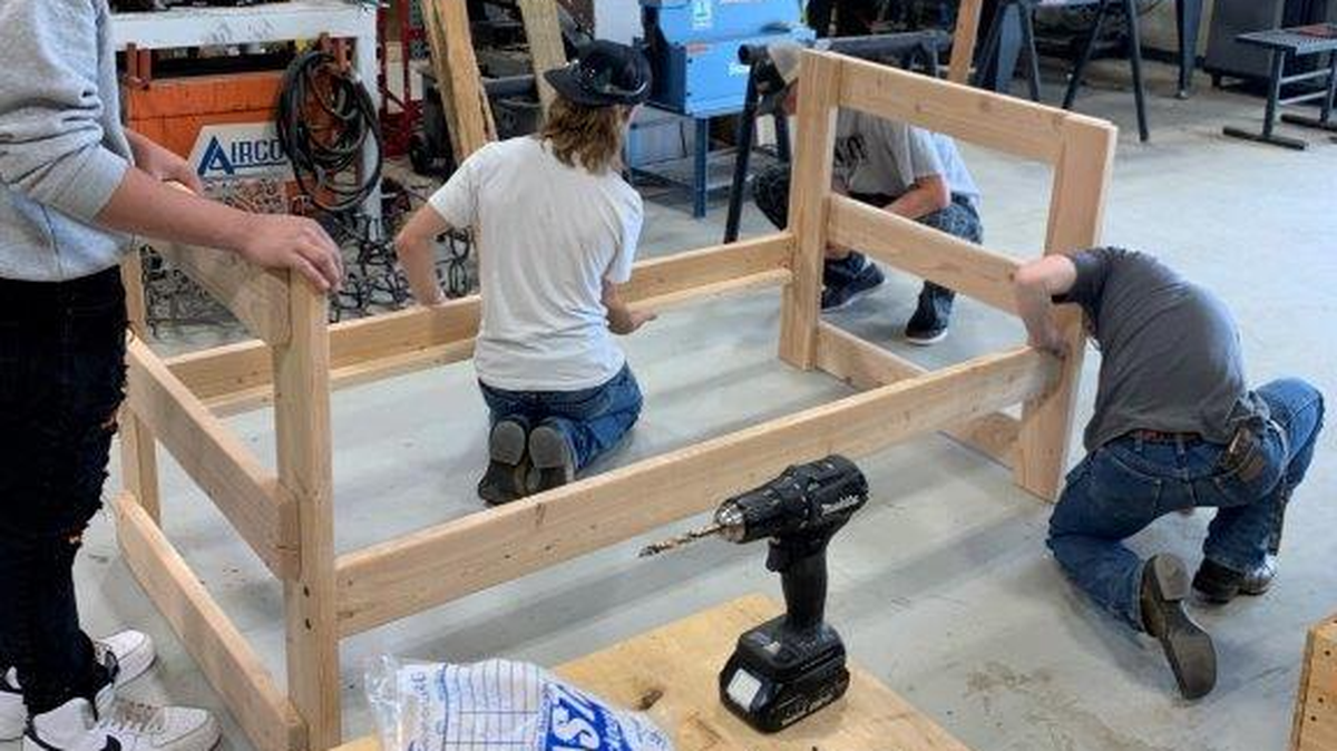 Finley High School students work on a bunk bed for a foster home as part of the FFA project.