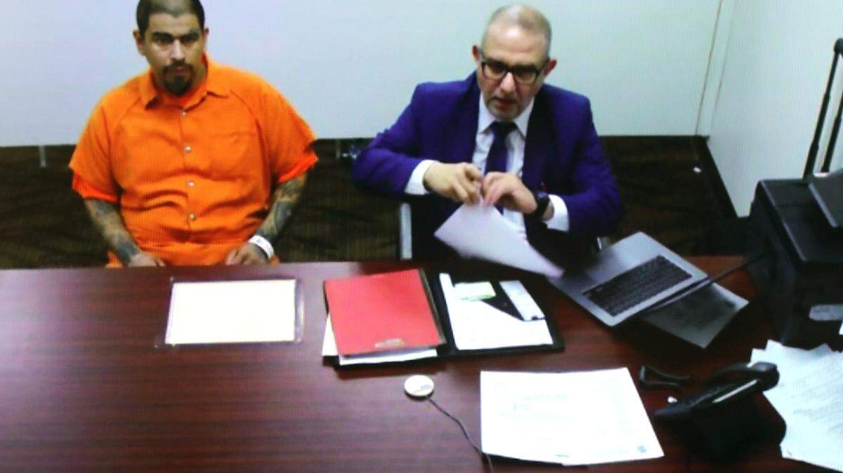 Murder suspect Jose A. Sanchez of Sunnyside appears with public defense attorney Peyman Younesi, right, by video from the Franklin County jail after being charged with killing Lupita Ponce-Penaloza.