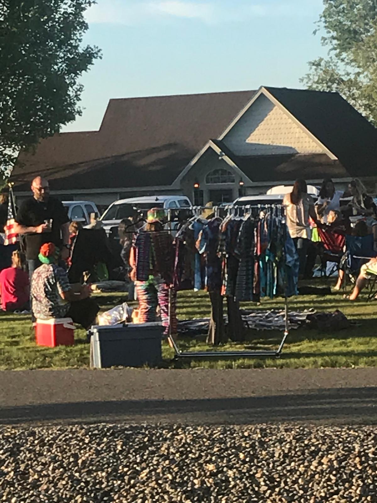 A large crowd gathered Friday, May 15, in the parking lot of the 3 Eyed Fish Kitchen + Bar on Keene Road in Richland.