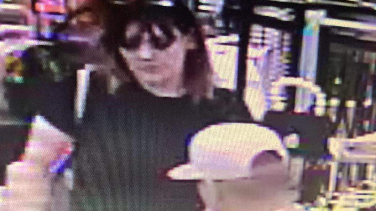 Kennewick police are looking for a man who allegedly directed to children to load up items into a cart before the children ran out of the store with the items.