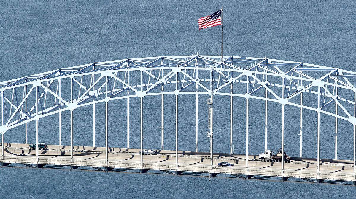 The U.S. flag flies over the Columbia River on the blue bridge linking Kennewick and Pasco.