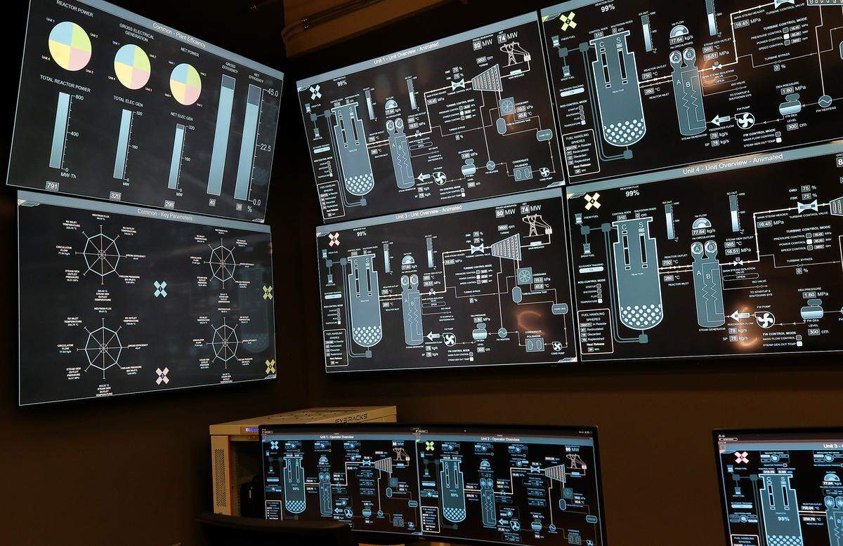 Computer monitors display an animation loop of the Small Modular Reactor simulator at the Institute for Northwest Energy Futures in Richland.