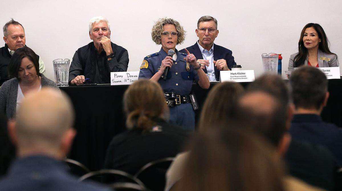 Capt. Deborah Wilson of the Washington State Patrol speaks at Wednesday's Franklin County Commissioner's public input session about the growing death toll and collision rates on Highway 395 in Franklin County near Pasco.  About 100 people attended the meeting at the HAPO center in Pasco.