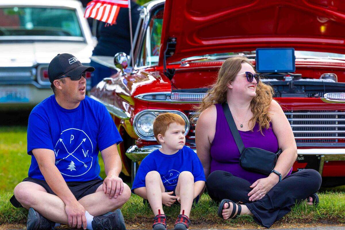 Keith and Colleen Wilson of Richland and their son, Otis, 4, watch the Slow Drags on Saturday during Cool Desert Nights along George Washington Way in Richland.