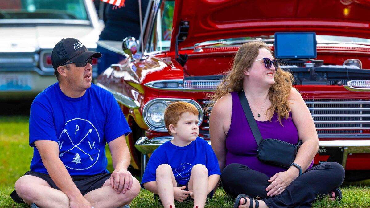Keith and Colleen Wilson of Richland and their son, Otis, 4, watch the Slow Drags on Saturday during Cool Desert Nights along George Washington Way in Richland.