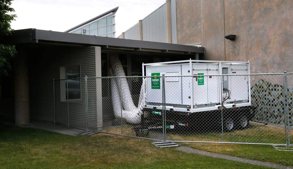 A trailer-mounted portable air conditioning unit, often used at construction sites, has provided a temporary solution to the problems plaguing the cooling system at the Kennewick Library on South Union Street in Kennewick.