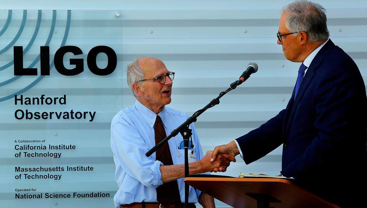 Then Gov. Jay Inslee, right, recognizes Nobel laureate Rainer Weiss as “Washingtonian of the Day” during the grand opening of the LIGO Exploration Center near Richland June 2, 2022. The 5,000-square-foot center features interactive exhibits to explain science concepts related to LIGO.