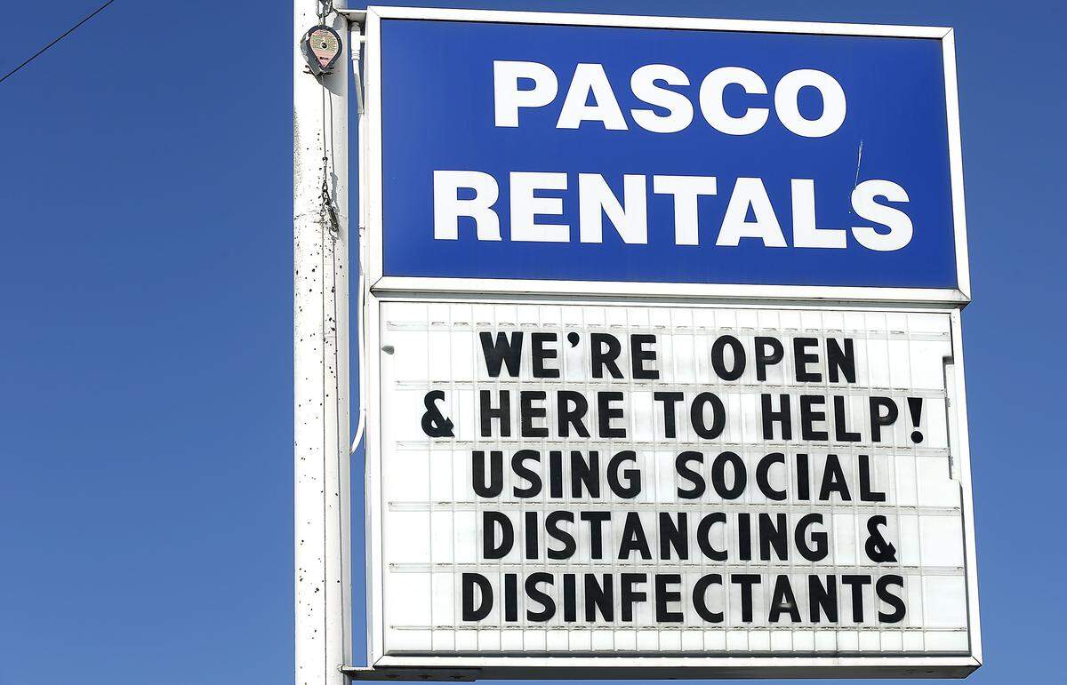 The sign at Pasco Rentals on West Court Street lets potential customers know the business is still open during the emergency orders issued recently by Gov. Jay Inslee declaring temporary closures for many stores during the coronavirus pandemic.