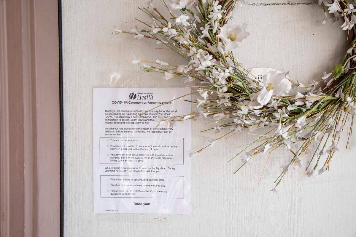 A Washington State Department of Health notice about COVID-19/Coronavirus hangs on the door of Tranquility Haven, a nursing home in Kennewick on March 10, the same day a proclamation from Gov. Inslee announced new rules that focus on better protecting older adults in nursing homes and assisted living facilities during the ongoing statewide health crisis.