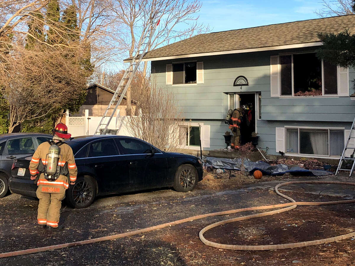 Fire heavily damaged this two-story home Wednesday afternoon at 4 N. Lincoln St. in Kennewick.
