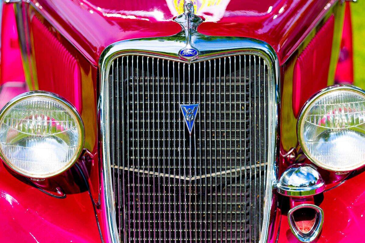 The front grille of a restored classic automobile is seen Saturday during the Show N Shine at Cool Desert Nights in Richland. Vehicle owners displayed restored and customized automobiles throughout the Uptown Shopping Center during the annual event.