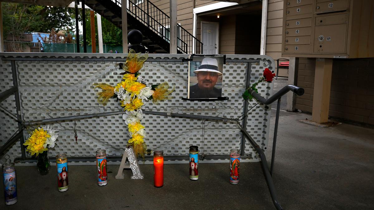 A memorial has been created by family and friends in the breezeway of the Kennewick apartment building where Arthur Amaya was shot to death late Sunday night.