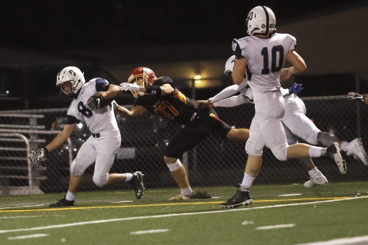 Chiawana’s Riley Cissne (8) intercepts the ball against Kamiakin as Champ Grayson (17) attempts to stop him. Cissne led the Mid-Columbia Conference with seven interceptions during the regular season.