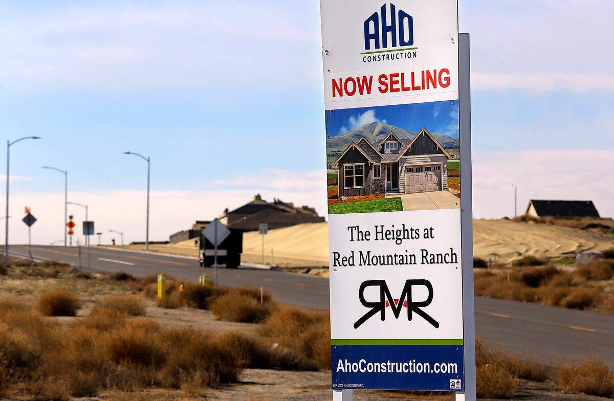 A sign near Keene and Ruppert Roads in West Richland advertises for the The Heights at Red Mountain Ranch housing development near the base of Red Mountain.