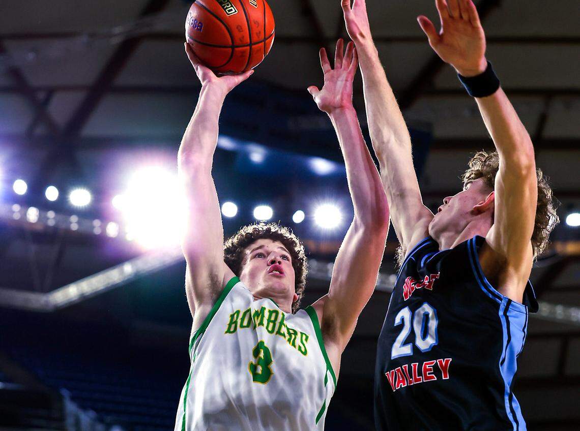 Richland’s Lance Horntvedt (3) shoots over West Valley’s Austin Birley (20) during the WIAA Class 4A boys state basketball quarterfinals Thursday, March 5, 2026 at the Tacoma Dome in Tacoma. Horntvedt scored 20 points as Richland defeated West Valley 76 to 62 to advance to the semifinals.