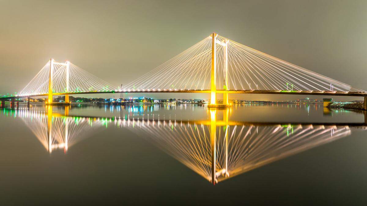 Local photographer Kevin Roylance turned a hobby into a lifestyle, shooting photos of the heavens and the Tri-Cities at night. This reflection of the cable bridge on a hazy night is one of his favorites.