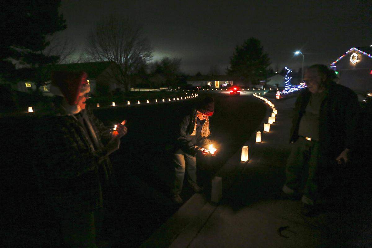 Neighbors light up their luminarias for the Desert Plateau Luminaria in Pasco.