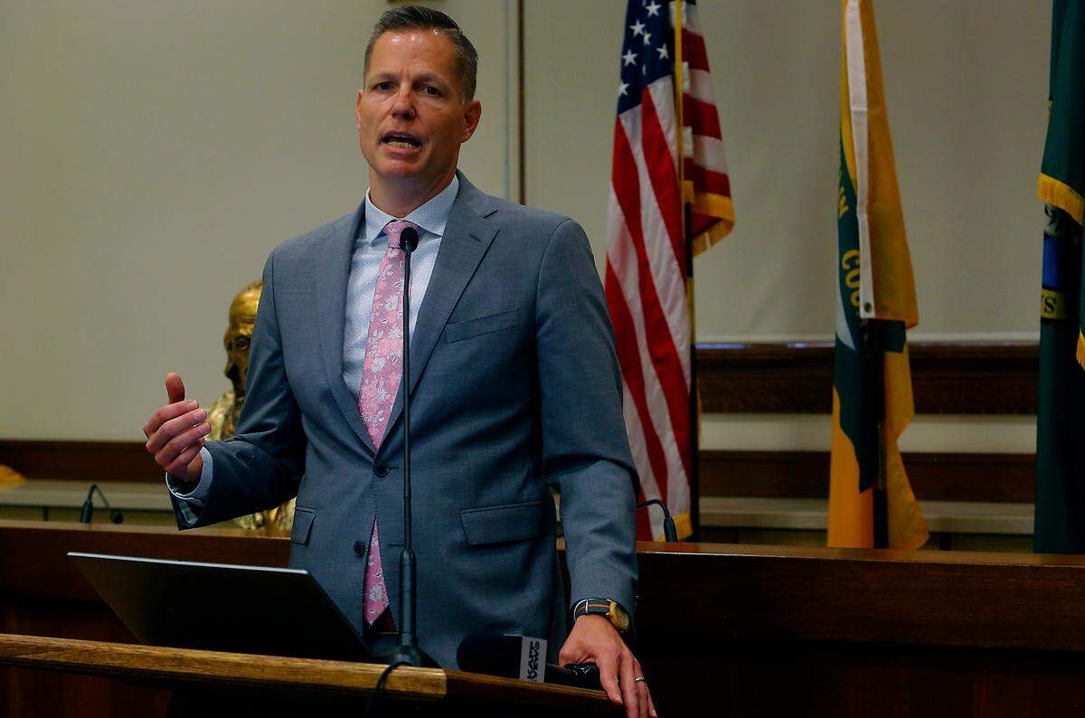 Benton County Prosecutor Eric Eisinger speaks during the news conference discussing the crumbling Washington state public defense system.